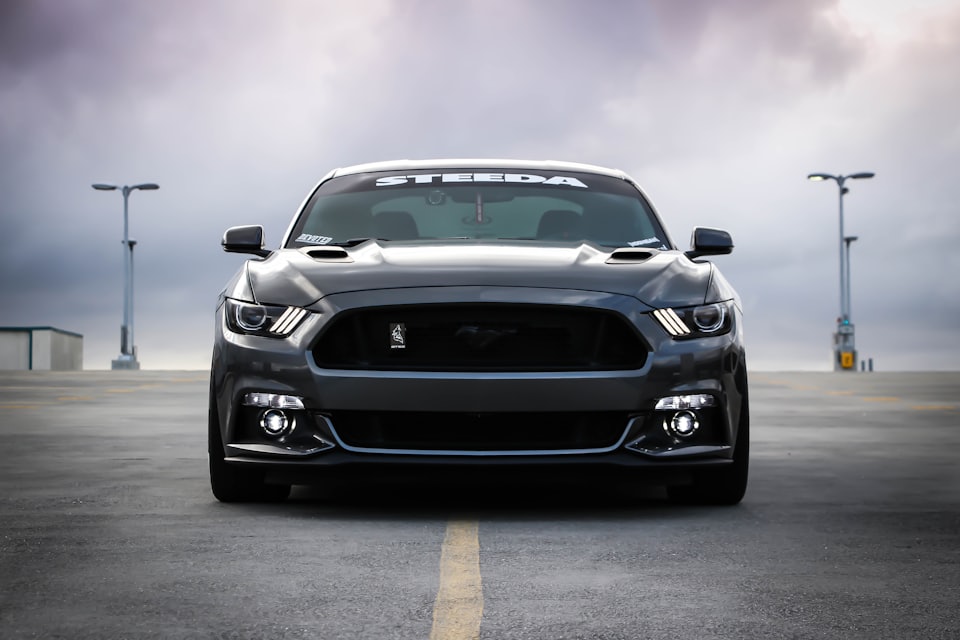 A dark sedan seen from the front